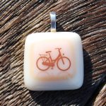 http://www.etsy.com/listing/40393495/bicycle-pendant-fused-glass-pendant-bike