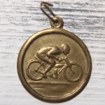 http://www.etsy.com/listing/150363434/vintage-bicycle-medal-light-brass-charm