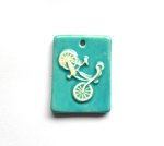 http://www.etsy.com/listing/129074105/handmade-ceramic-bicycle-pendant-in